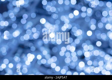 Abstrakt Blau Hintergrund mit Nachtlicht, Bokeh. Unscharfer Hintergrund defokussierten glänzend Kreise, Textur. Beleuchtete feier Kulisse. Glühende Effek Stockfoto