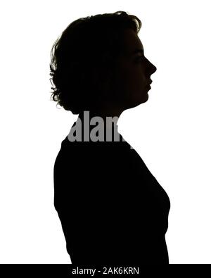 Silhouette von Kopf und Schultern einer Frau, mit Hintergrundbeleuchtung. Stockfoto