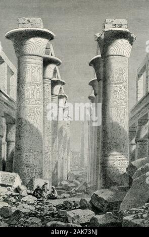 Diese Abbildung der Ruinen der Halle der Spalten in Karnak stammt aus den frühen 1900er Jahren. Die Große hypostyle Halle Karnak besteht aus 134 gigantische Sandstein Säulen in Form von Papyrus Stiele. Zwölf große Spalten in seiner zentralen Kirchenschiff sind 70-plus Fuß in der Höhe und werden von riesigen offenen Papyrus blossom Hauptstädte gedeckelt. Die wichtigste Ost-West-Achse der Säulenhalle ist durch eine doppelte Reihe von 12 riesige Säulen dominiert. Stockfoto