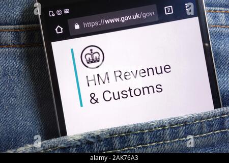 Die Regierung des Vereinigten Königreichs website für HM Einnahmen und Zoll auf dem Smartphone in Jeans Tasche versteckt angezeigt Stockfoto
