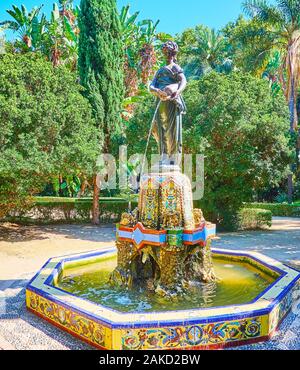 Die malerische Nymphe (Nimfa del Cantaro) Brunnen in Malaga Park mit kunstvollen Fliesen Dekoration rund um es, Spanien Stockfoto