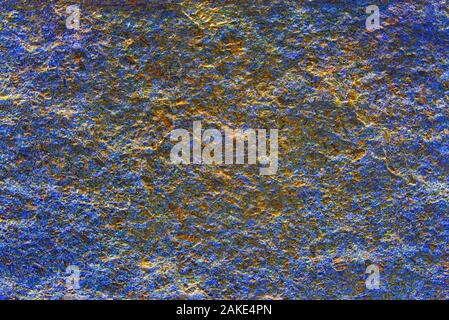 Alte verkratzte Blau und Gold blur verputzte Hauswand. Stockfoto