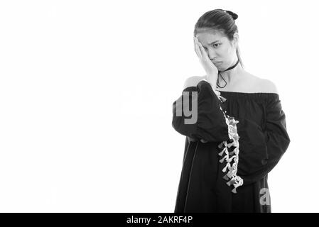 Studio geschossen von jungen asiatischen Frau, Gesicht, während Sie betonte Stockfoto