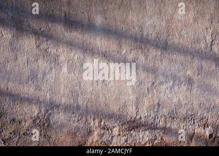 Alte, verputzte Wand, veraltert und verwittert, abstrakter Texturhintergrund Stockfoto