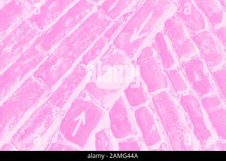 Hintergrund der Struktur des Steinpflasters. Pink adn weiß Verlauf abstrakter Hintergrund. Straßen führen zum Liebeskonzept Stockfoto