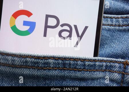 Google Logo auf dem Smartphone in Jeans Tasche Zahlen ausgeblendet Stockfoto