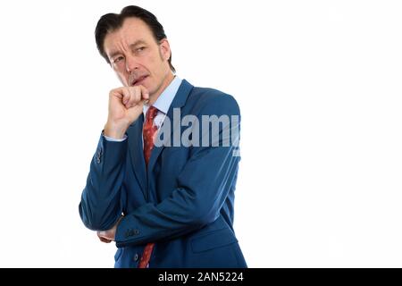 Studio shot reifer wütend Geschäftsmann denken Stockfoto