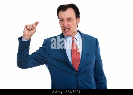 Studio shot reifer Geschäftsmann auf der Suche wütend, während der Zeigefinger Stockfoto
