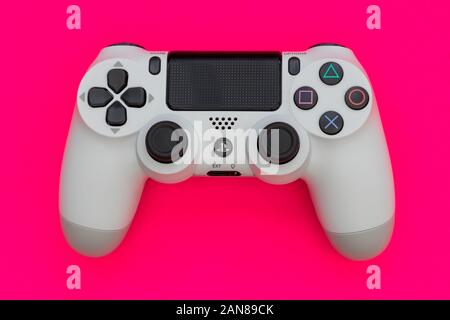 LONDON - Dezember 10, 2019: Video Game Gaming Controller auf hell-rosa Farbe Hintergrund der Ansicht von oben Stockfoto