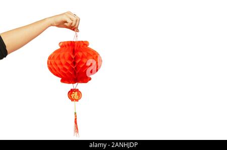 Happy Chinese New Year 2020. Weibliche Hand, die rote Laterne auf weißem studio Hintergrund isoliert. Feier, Dekoration, urlaub Konzept. Copyspace für Ihre Anzeige. Stockfoto