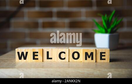 Willkommen Wort auf Holz Block geschrieben, Business Konzept Stockfoto