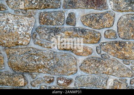 Nahaufnahme eines sauber wies unregelmäßige Cornish Granit stone wall, Cornwall, England, Großbritannien Stockfoto