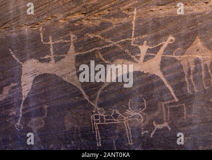 Felszeichnungen auf einem Felsen, die Männer Jagd auf Pferden, Provinz Najran, Minshaf, Saudi-Arabien Stockfoto