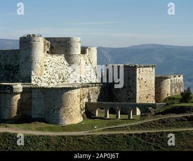 Syrien Arabische Republik. Krak des Chevaliers. Crusader Castle, die unter der Kontrolle des Johanniter Ritter (1142-1271) während der Kreuzzüge in das Heilige Land, fiel in die Arabischen Steuerung im 13. Jahrhundert. Foto vor dem syrischen Bürgerkrieg. Stockfoto