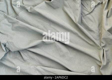 Die Struktur des Stoffes ist olivfarben, was der Uniform amerikanischer Soldaten des Zweiten Weltkriegs ähnelt. Hintergrundbild für Militar Stockfoto
