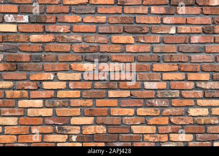 Ein gelber und roter Backstein Wand Vintage und Retro Stockfoto