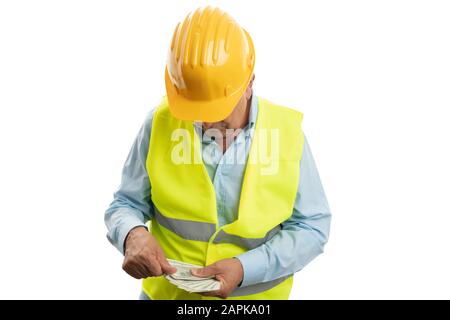 Seriöse alte Ingenieurin zählt Dollar als Lohn- oder Bestechungsgeld-Konzept isoliert auf weißem Hintergrund Stockfoto