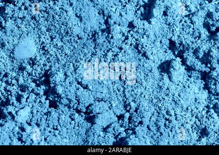 Bausandtextur Nahaufnahme. Natürlicher abstrakter Hintergrund, blaue Farbe Stockfoto