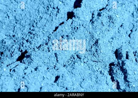 Bausandtextur Nahaufnahme. Natürlicher abstrakter Hintergrund, blaue Farbe Stockfoto
