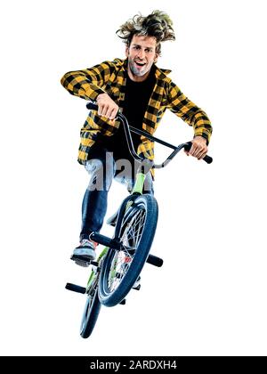 Ein junger kaukasischer Mann BMX-Fahrer Radfahrer Freestyle Akrobatic Stunt im Studio isoliert auf weißem Hintergrund Stockfoto
