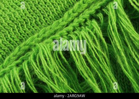 Nahaufnahme Bild aus grünem Strickmaterial mit Fringe Stockfoto