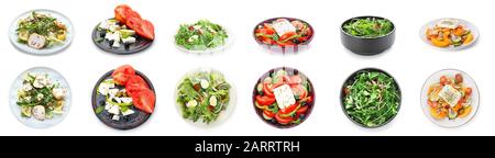 Verschiedene leckere Salate auf weißem Hintergrund Stockfoto