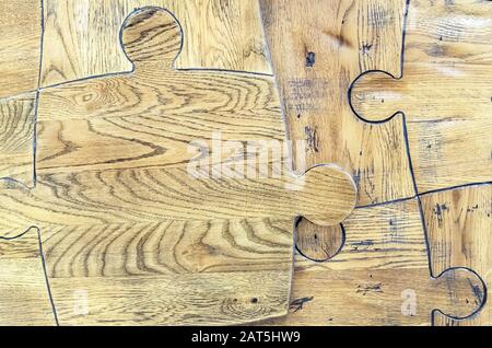 Holzpuzzles. Puzzles aus einem Parkett. Stockfoto