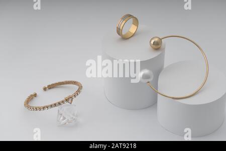 Zwei moderne goldene Armbänder und goldener Ring auf weißem Papiergrund Stockfoto