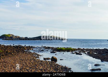 Sonnenuntergang Blick über Oldshoremore Strand, Bucht mi Sandstrand im Norden von Schottland Stockfoto