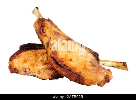 Zwei gegrillte Tomahawk-Schweinekoteletts isoliert auf weißem Hintergrund Stockfoto
