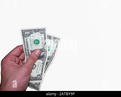 Die Hand hält und drückt die Dollar. Stockfoto