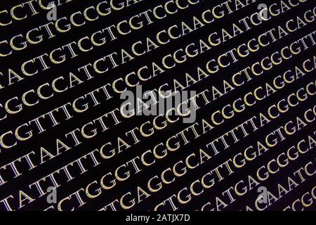 Abstrakter Hintergrund, genetischen Code. Sequenz von Nukleotidbasen in einem DNA-Fragment. Stockfoto