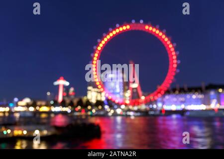 Bokeh Zusammenfassung von London Eye oder Millennium Wheel in der Nacht in London, Großbritannien Stockfoto