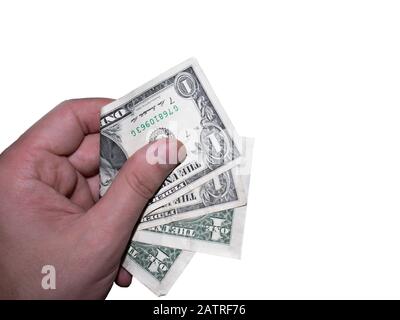 Die Hand hält und drückt die Dollar. Stockfoto