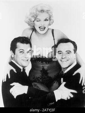 1959 , USA : die Schauspieler MARILYN MONROE , TONY CURTIS und JACK LEMMEN , Pubblicity noch für den Film EINIGE MÖGEN ES HEISS ( EIN qualcuno piace caldo ) b Stockfoto