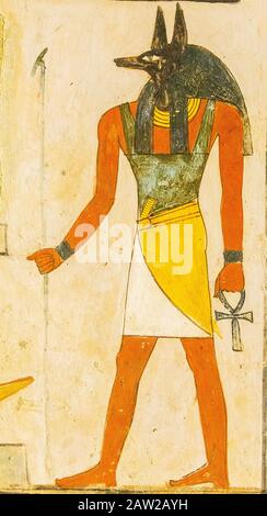 Luxor in Ägypten, Tal der Nobles, Grab von Menna. Der gott Anubis, der typischerweise mit einem Schakalkopf (oder schwarzem Hund) dargestellt wird. Stockfoto