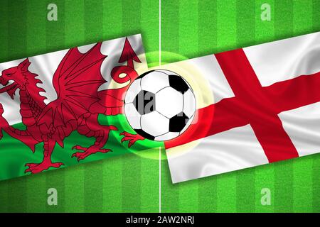 Green Soccer/Football Field mit Streifen und Flaggen von wales - england und Ball. Stockfoto