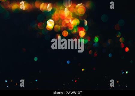 Farblicht bokeh, buntem Glanz auf schwarzem Hintergrund, Überlagerungsschicht. Stockfoto