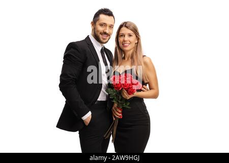 Junger Mann und Frau in eleganter Kleidung mit roten Rosen isoliert auf weißem Hintergrund Stockfoto