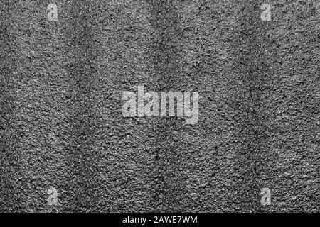 Abstrakte Hintergrundstruktur aus Polystyrol-Schaum. Nahaufnahme der Makrofotografie mit schwarzem Styrofoam, Kunststoffblechmuster, abstrakten Styroporen Stockfoto