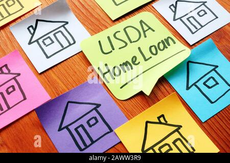 USDA Home Loan und zog Häuser auf einem Papier. Stockfoto