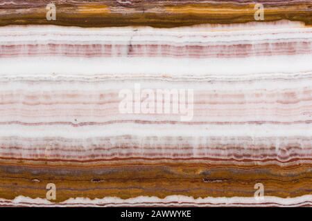 Rote und braune Onyx-Ziersteinstruktur. Stockfoto