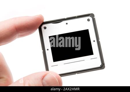 Foto-Folie in der Hand isoliert auf weißem Hintergrund. Stockfoto