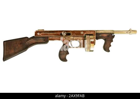 Alte goldfarbene Maschinenpistole isoliert auf weißem Hintergrund Stockfoto