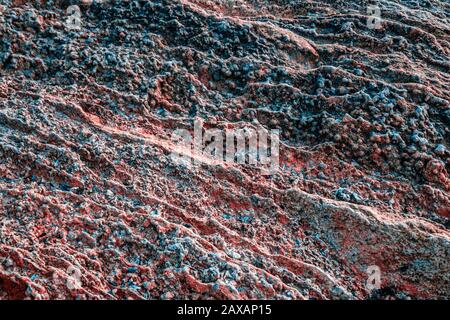 Gerippte blaue goldene Textur auf dem Stein. Abstrakter Hintergrund Stockfoto