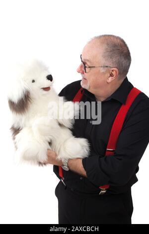 Ein Ventriloquist mit einem Hund als Marionette Stockfoto