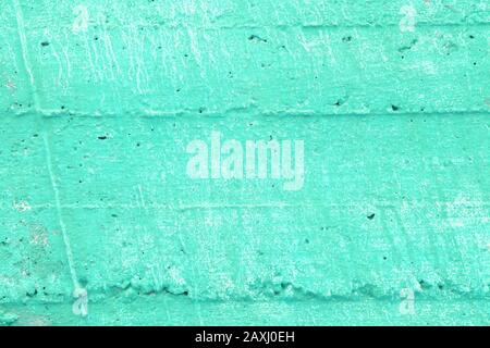 Grunge Textur. Betonwand blau lackiert. Grungeliger türkisfarbener Hintergrund. Stockfoto