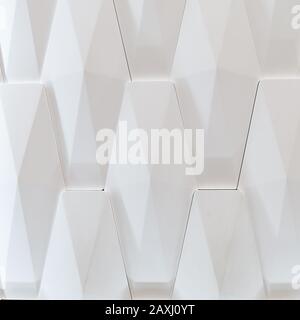 3D-Zierwand für das Innere einer ungewöhnlichen geometrischen Form. Weißer Lichthintergrund mit einem Muster, das einen Baum imitiert. Abstrakte Textur Stockfoto