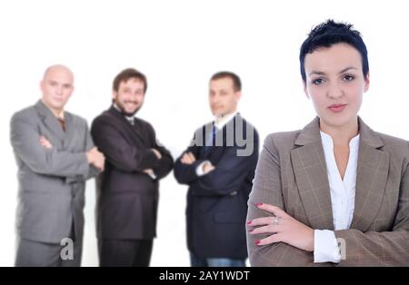 Junge attraktive Geschäftsfrau vor der Gruppe der Geschäftsleute Stockfoto