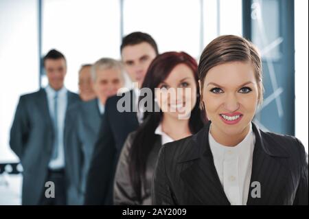 Gruppe von Geschäftsleuten in einer Schlange stehen Stockfoto